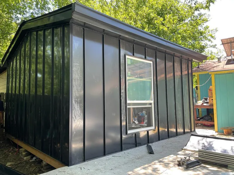 Black standing seam metal wall panels for Metal Roof Installation in Farmville